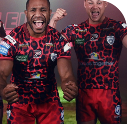 Leigh Leopards players celebrating in the club's leopard-print kit