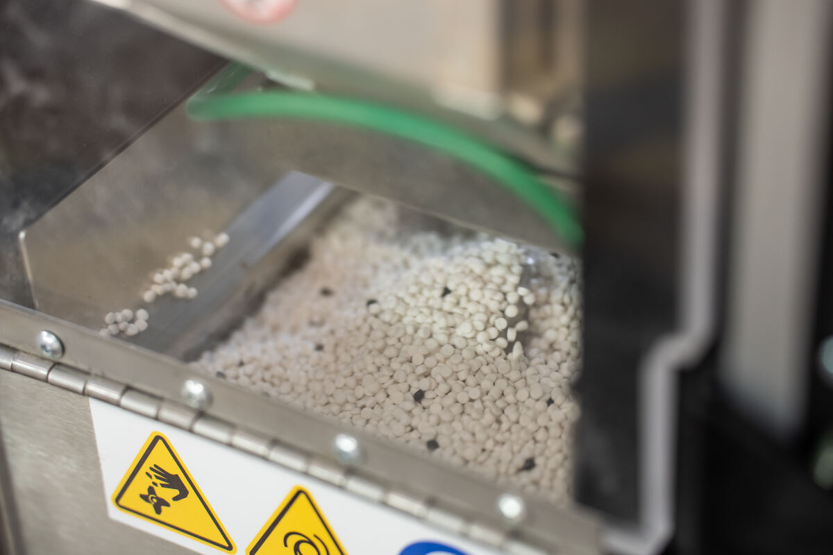 Cable compound pellets in an extruder hopper